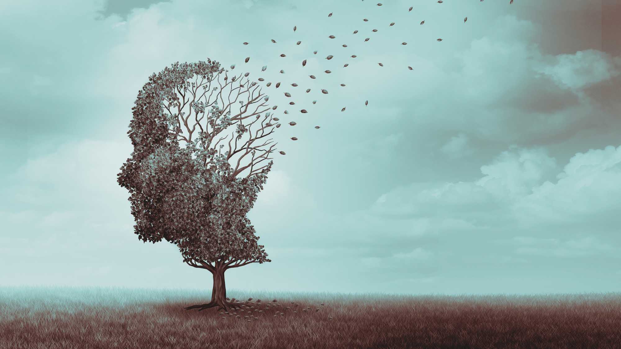 Representació visual de la degeneració cognitiva en l’Alzheimer amb un arbre en forma de cervell que perd fulles